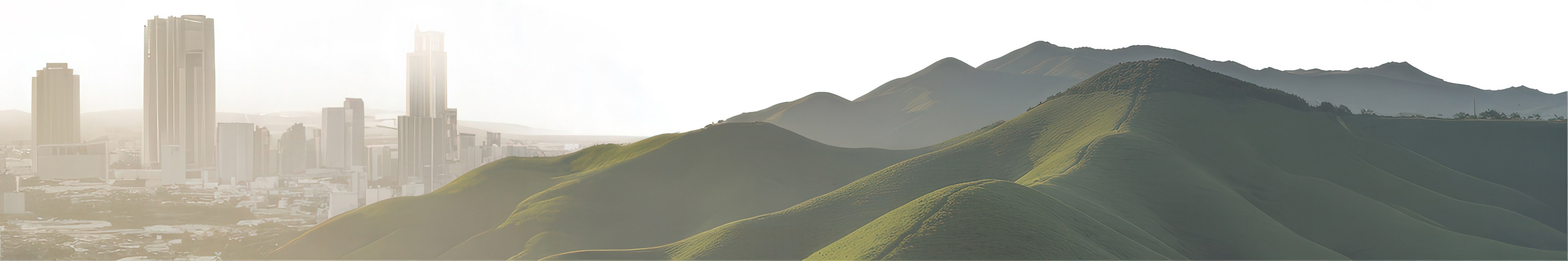 Des collines vallonnées et une ville en arrière-plan
