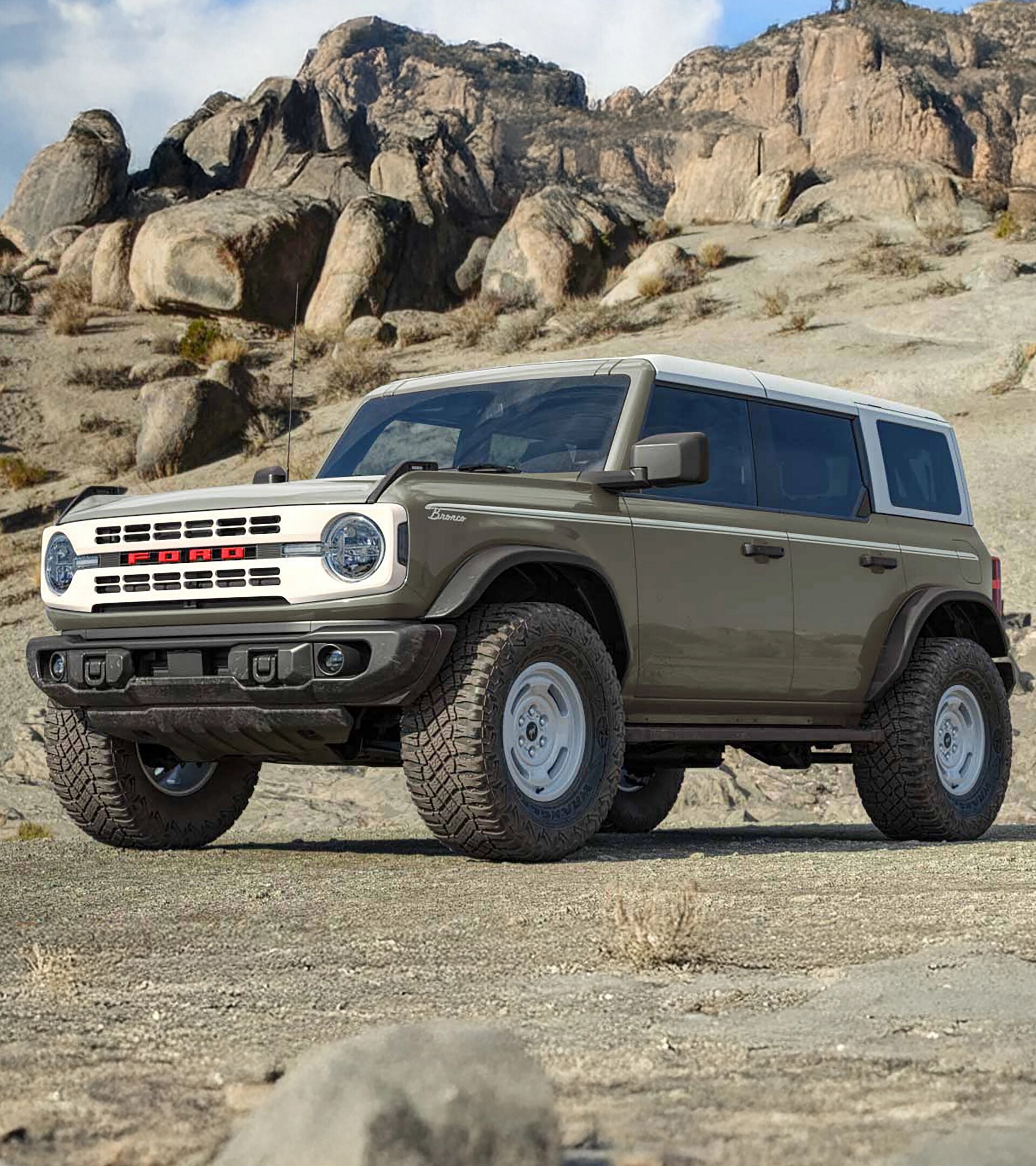 Un VUS Ford Bronco® Heritage Edition 2026 garé sur une vasière, avec une falaise rocheuse en arrière-plan.